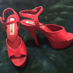 Fire engine red platform open toed heels.